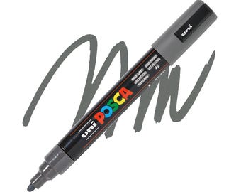 May include: A deep gray Uni Posca paint marker with a chisel tip, lying on a white background with a gray paint stroke. The marker has the text "Uni Posca" in colorful letters and "Deep Grey" printed on the side.