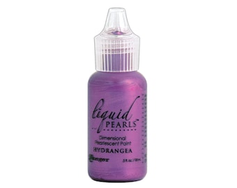 May include: A small bottle of purple iridescent paint labeled "Liquid Pearls Dimensional Pearlescent Paint Hydrangea" by Ranger.