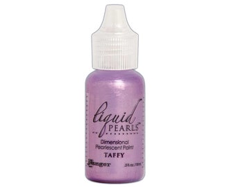 May include: A bottle of "Liquid Pearls" dimensional pearlescent paint in the color "Taffy." The bottle is a light purple color with a clear cap and a white label. The label includes the brand name "Ranger" and the paint volume, .5 fl oz / 18 ml.