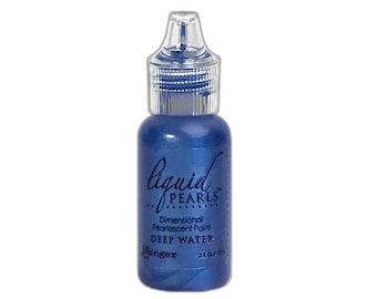 May include: A small bottle of blue pearlescent paint labeled "Liquid Pearls Dimensional Pearlescent Paint Deep Water" by Ranger.