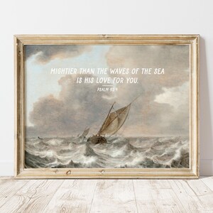 May include: A framed print with a painting of a sailboat on a stormy sea. The print has a quote from Psalm 93:4, "Mightier than the waves of the sea is his love for you."