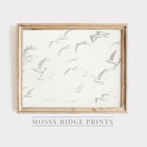 May include: A framed print of a white background with a pattern of gray birds in flight. The frame is a light wood color. The text "Mossy Ridge Prints" is below the frame.