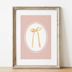 May include: A pink printable art print with a gold bow in the centre and a white oval border with the text "You are my sunshine, my only sunshine, you make me happy when skies are gray."