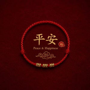 May include: A red braided bracelet with three gold beads. The bracelet is set against a deep red background. Gold Chinese characters and the words "Peace & Happiness" are above the bracelet.