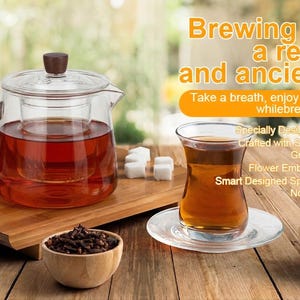 May include: A glass teapot with a wooden handle and infuser, filled with tea. A glass of tea sits on a saucer, alongside a wooden bowl of tea leaves. The image includes the text: "Brewing tea is a revered and ancient art."
