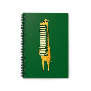 May include: A spiral-bound notebook with a green cover featuring a cartoon giraffe wearing glasses and carrying a stack of books. The giraffe is yellow with orange spots, and the books are white with yellow pages.