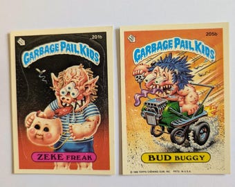ガーベージ・ペイル・キッズ ロット – 「目が飛び出る」GPK フリーキー・フェイシズ バド＆ジーク セット