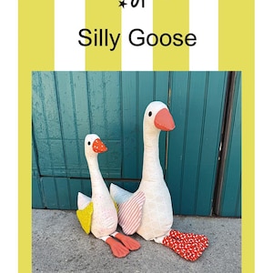 May include: A sewing pattern titled Silly Goose by Woolly Petals featuring two stuffed fabric geese, one 16 inches and one 20 inches tall. The geese have white bodies with patterned wings in yellow, pink, and orange, and orange webbed feet.