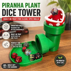 May include: A green Piranha Plant dice tower with a red and white plant head. The tower includes a built-in tray and is designed for D&D, Pathfinder, and tabletop RPGs. The text on the image says "Great Gift for Gamers!"
