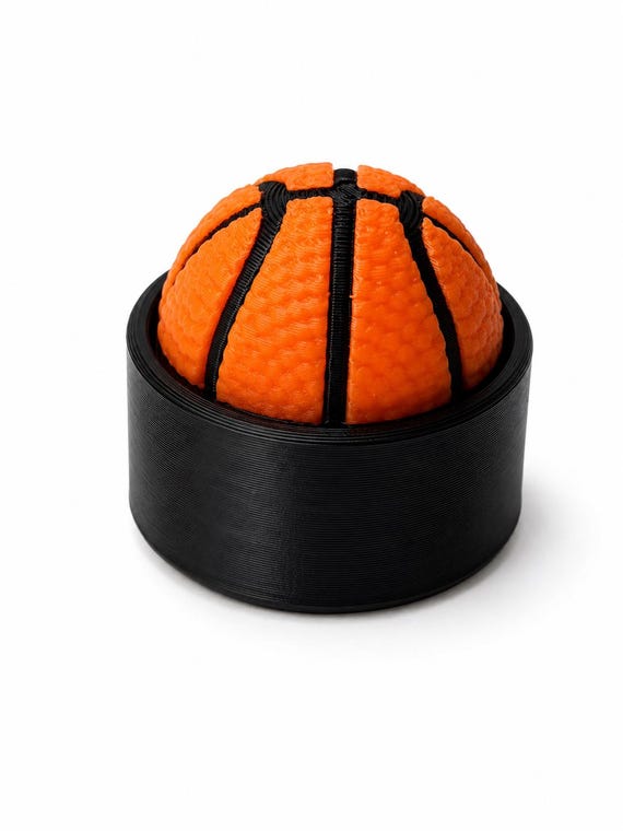 Basketball clicker fidget showing textured surface detail