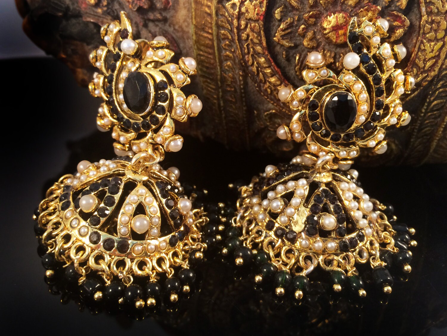 Black and 2024 gold jhumka earrings