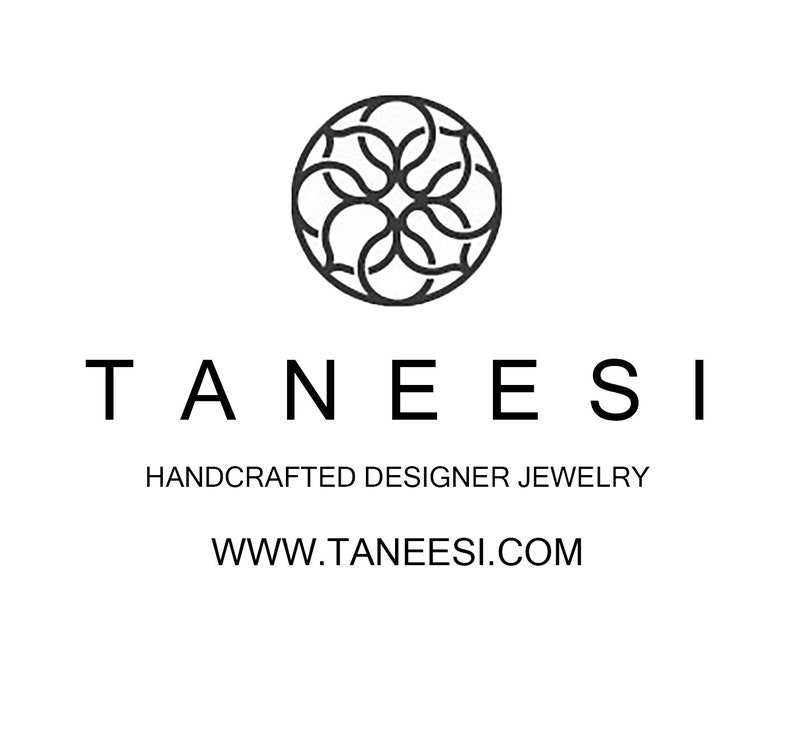 May include: Black and white logo for Taneesi, a handcrafted designer jewelry company. The logo features a stylized floral design and the company name and website address: www.taneesi.com.