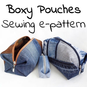 May include: Three denim pouches with zippers. The pouches are made from different shades of blue denim and have brown fabric accents. The pouches are arranged in a row on a white surface. The text "Boxy Pouches Sewing e-pattern" is written in black at the top of the image.