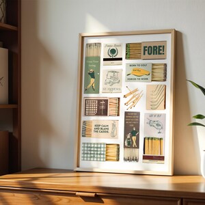 May include: A framed collage of vintage matchbox labels with a golf theme. The labels feature illustrations of golf clubs, golf carts, and golfers. The text on the labels includes "FORE!", "Born to Golf", "Forced to Work", "Keep Calm and Blame the Caddie", and "St Andrews".