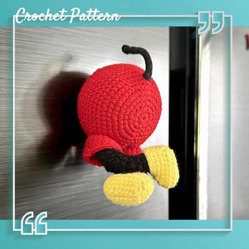 Mickey Mouse butt magnetic hook crochet pattern displayed alongside colorful yarn and crafting supplies