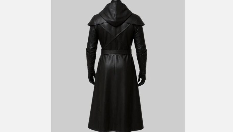 May include: A long, black leather coat with a hood, belt, and gloves. The coat has a sleek, tailored design with a flowing skirt. The sleeves have a unique armored look. The coat is shown from the back.