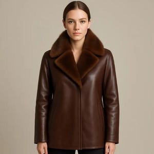 May include: A brown leather jacket with a fur collar. The jacket has a classic design with a notched lapel and a button closure. The fur collar is a lighter shade of brown, adding a touch of luxury to the outerwear.