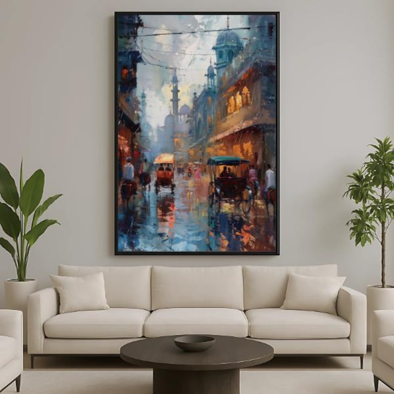 May include: An abstract painting of a city street scene with rickshaws and buildings. The artwork features a color palette of blues, oranges, and browns, with a focus on light and shadow. The painting is framed in a black frame.