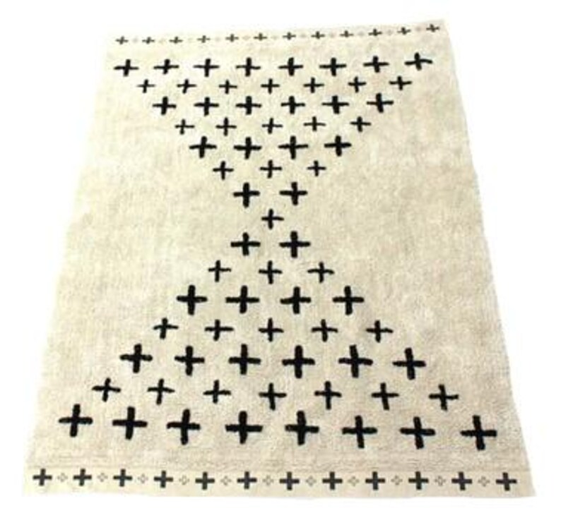 A 5x7 ft large area rug, made by hand,machine washable, in ivory and black, bespoke, bohomien desing in plus, by rich class decor