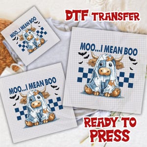 May include: DTF transfer sheets featuring a cartoon cow dressed as a ghost with the text "MOO...I MEAN BOO". The design includes bats and blue checkered squares. The words "READY TO PRESS" are also visible.
