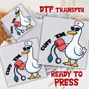 May include: DTF transfer featuring a cartoon goose wearing sunglasses and a nurse's hat, holding a blood pressure cuff. The text "CUFF 'EM" is printed on the design. The words "DTF TRANSFER" and "READY TO PRESS" are also visible.