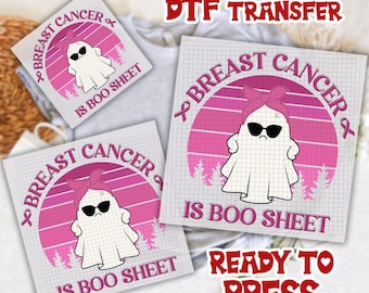 May include: DTF transfer sheets with a ghost design. The design includes the text "Breast Cancer" and "Is Boo Sheet" with a pink ribbon and a ghost wearing sunglasses and a pink headband. The words "Ready to Press" are also visible.