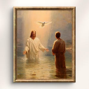 May include: A framed religious painting showing a biblical scene. Jesus stands in water, arms open, with another figure facing him. A white dove flies above, illuminated by light. The artwork is framed in a gold-coloured ornate frame.