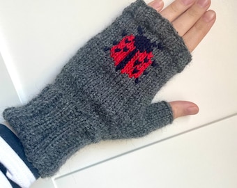 Grey wool fingerless gloves with an embroidered ladybug ladybird pattern fairisle