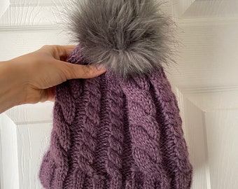 Hand knitted warm purple wool hat in cables pattern faux fur pompom extra warm