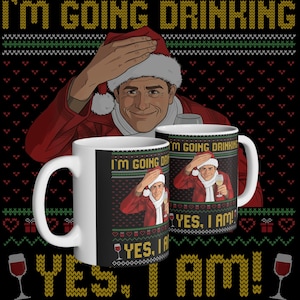 May include: Two white ceramic mugs with a festive design. The mugs feature a man in a Santa hat and the text "I'M GOING DRINKING" and "YES, I AM!". The background is a black sweater pattern with wine glasses.