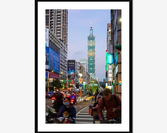 Taipei 101 Skyscraper at Dusk amidst the busy commuter streets of downtown Taipei, Taiwan