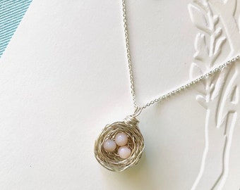 Serling silver bird nest pendant necklace with pink eggs made of Peruvian pink opals. Argentium chain. Personalize by picking your eggs!