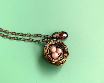 Personalized bird nest pendant necklace with Peruvian pink opal eggs and Garnet. Pick your choice of eggs and letter initials charms!