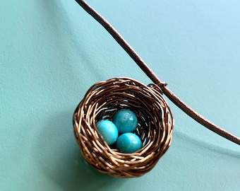 Large bird nest pendant necklace with blue eggs, made with semiprecious Kingman turquoise from Arizona! Personalize it with letter charms