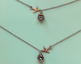 Tiny bird nest direction pendant necklace with blue Kingman turquoise eggs. Pick your eggs, letter initials, and a bird flying east or west!