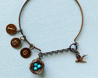 Personalized nest bracelet with sought-after Sleeping Beauty turquoise! Inspired by the American robin. Pick your eggs and letter charms!