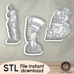 May include: Three white 3D-printed cookie cutters in the shapes of classical sculptures: a headless statue, the bust of Nefertiti, and Rodin's The Thinker. The text "STL File instant download" is at the bottom.