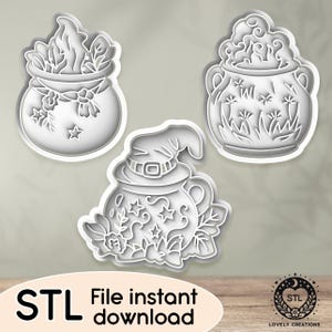 Może przedstawiać: Trzy pliki cyfrowe do druku 3D foremek do ciasteczek w kształcie kotła na Halloween. Projekty przedstawiają kocioł z kapeluszem czarownicy, kocioł z parą i kocioł z kwiatami.