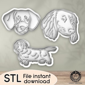 Puede incluir: Tres archivos STL blancos con forma de perro para impresión 3D. Los diseños incluyen dos perfiles de cabeza de perro y un perfil de cuerpo completo. La imagen también incluye el texto "STL File instant download" y un logotipo.