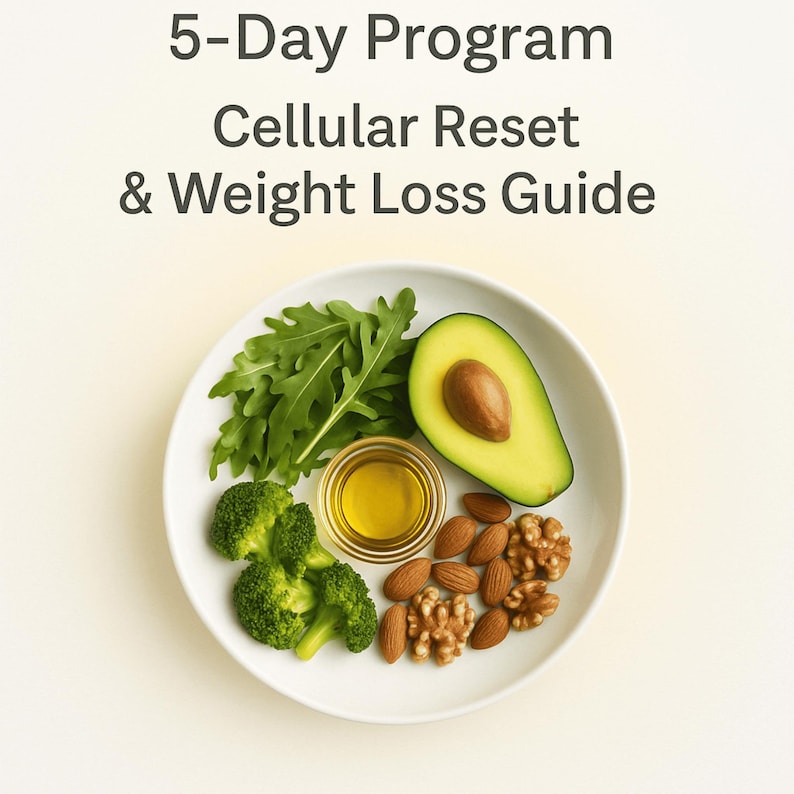 May include: A white plate with a healthy meal arrangement. It includes a halved avocado, broccoli florets, arugula, almonds, walnuts, and a small bowl of oil. Text at the top reads: "5-Day Program Cellular Reset & Weight Loss Guide."