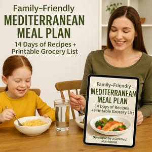 Puede incluir: Una tableta digital que muestra un plan de comidas titulado "Family-Friendly Mediterranean Meal Plan" con una foto de un plato de salmón. El texto en la tableta dice "14 Days of Recipes + Printable Grocery List" y "Developed by a Certified Nutritionist".