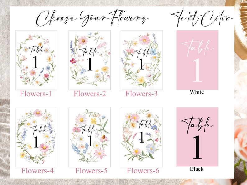May include: A selection of table number cards with floral designs and text color options. The cards feature the word "Table" and the number "1" in various floral wreath designs. Text color options include white and black.