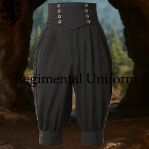 May include: Black high-waisted trousers with a distinctive design. The trousers have a high waistband with gold-coloured buttons and a gathered, cropped leg. The text "Regimental Uniform" is visible on the trousers.