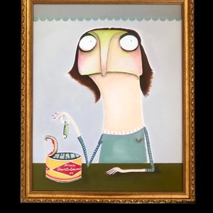 May include: A framed painting depicts a whimsical figure with large eyes and a long nose, holding a small fish above an open can of "Prima Surströmming." The artwork features a green, yellow, and brown color palette, with a gold ornate frame.