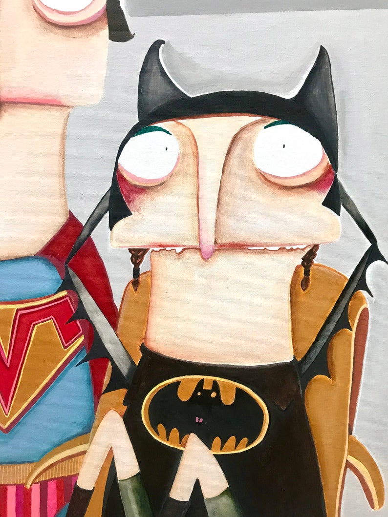 May include: A painting of a person dressed as Batman with a yellow bat symbol on their chest. The person has large eyes and a long nose. The person is sitting in a chair with a brown back.