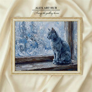 May include: An oil painting in a gold frame depicts a gray cat gazing out a window at a snowy scene. The artwork is signed "ALEX ART HUB" with the text "Bring the gallery home". The painting has a winter theme.