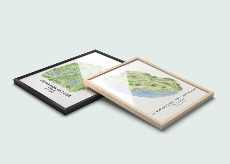 May include: Two framed watercolor prints of golf courses. One has a black frame and the text "Golden Hawk Golf Club". The other has a light wood frame and the text "St. Andrews Links - The Castle Course". The golf course illustrations are green and blue.