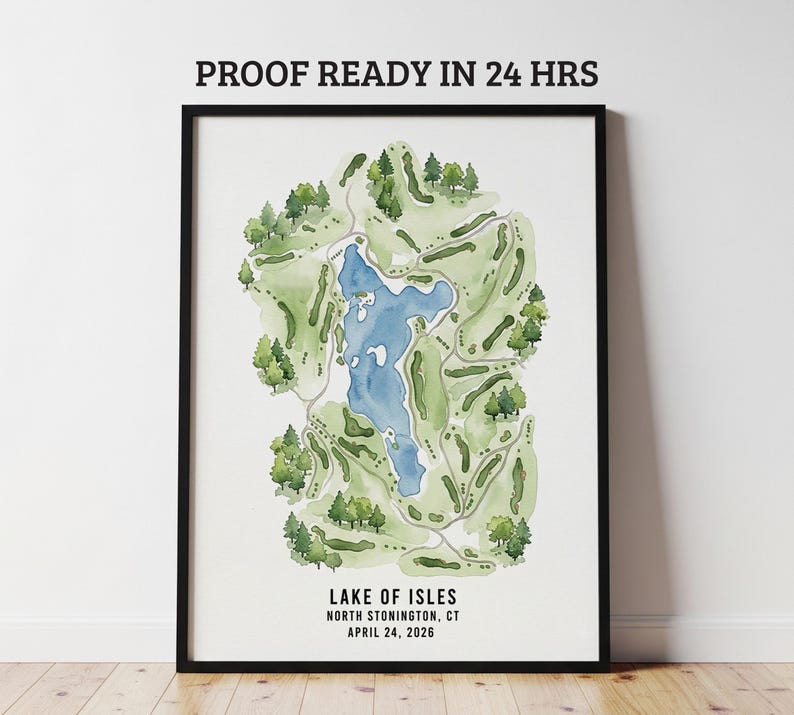 May include: A framed watercolor map of Lake of Isles in North Stonington, CT, featuring a blue lake surrounded by green golf course fairways and trees. The text "PROOF READY IN 24 HRS" is at the top, and the lake's name and date are at the bottom.