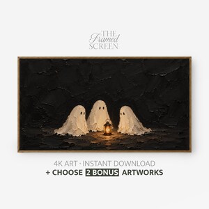 May include: A rectangular framed digital artwork titled THE FRAMED SCREEN featuring three white ghost figures gathered around a glowing lantern against a dark, textured black background. The text below reads 4K ART INSTANT DOWNLOAD + CHOOSE 2 BONUS ARTWORKS.