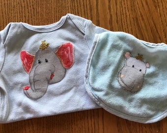 11 embellished bibs and 2 onesies